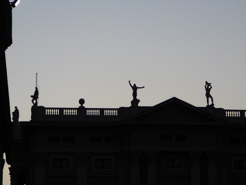 Barcelona likes putting statues of people on top of buildings